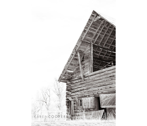 A black and white detail of an old barn, looking up. 